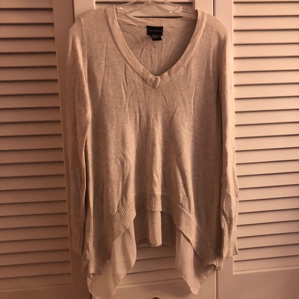 Cream sweater with asymmetrical hem